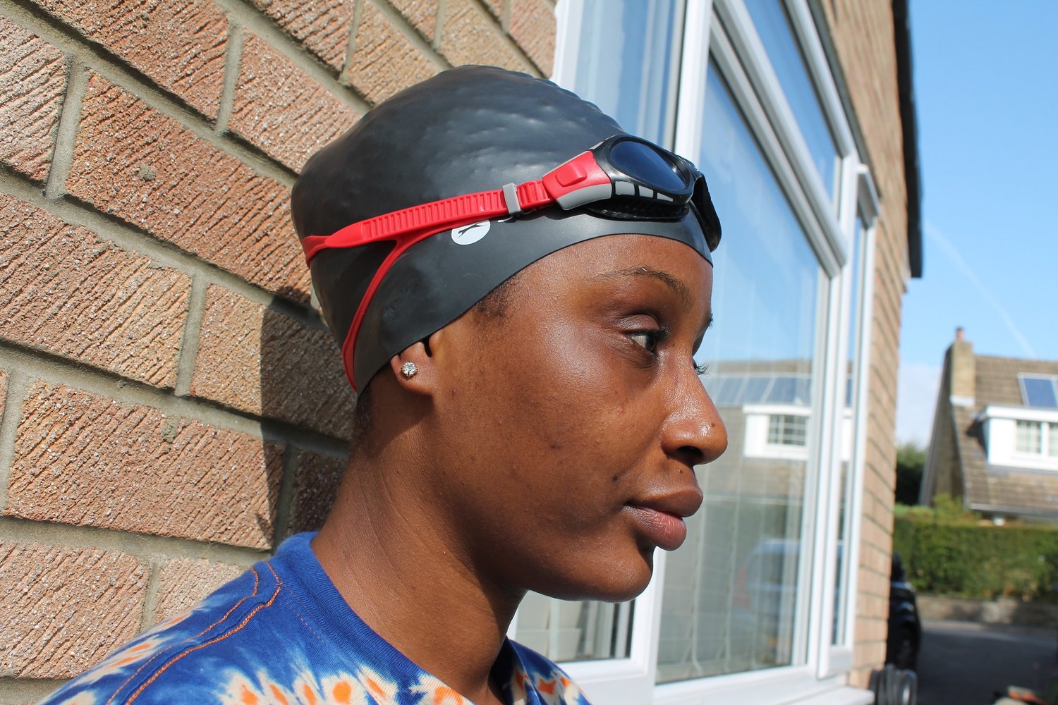 image of a woman wearing a swimming cap and swimming goggles