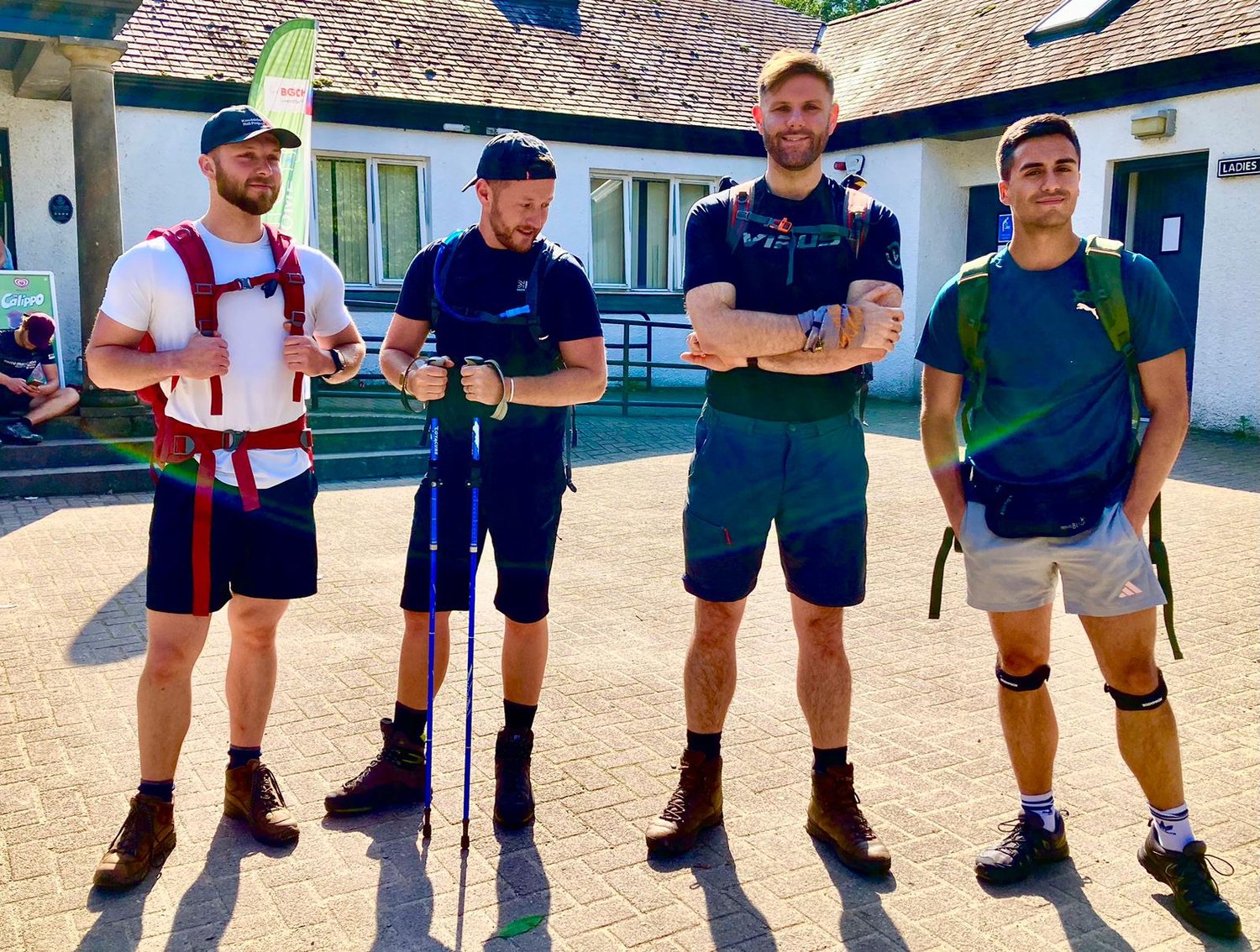 Image of 4 men in hiking clothes